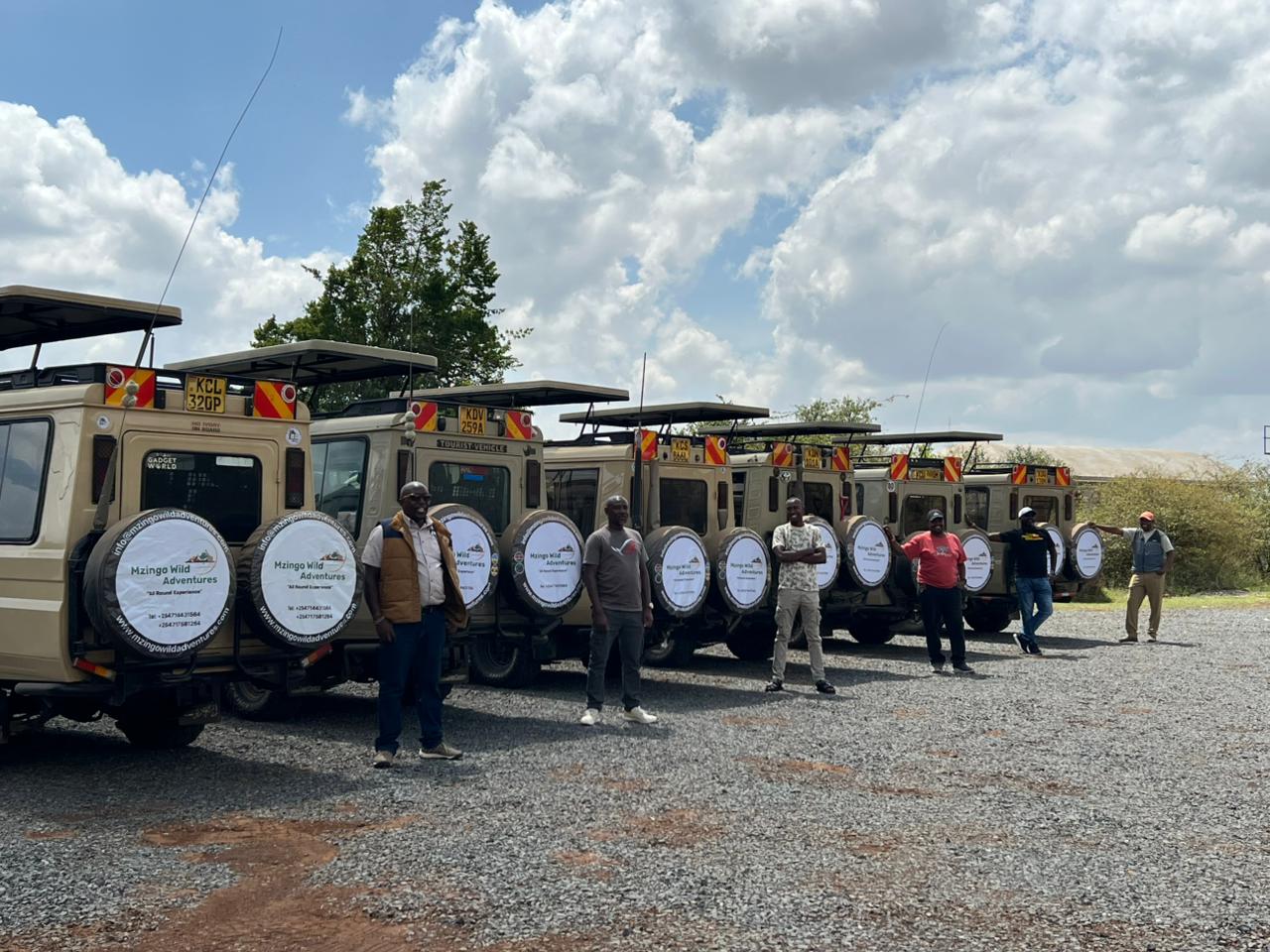 A lineup of Mzingo Wild Adventures branded safari vehicles