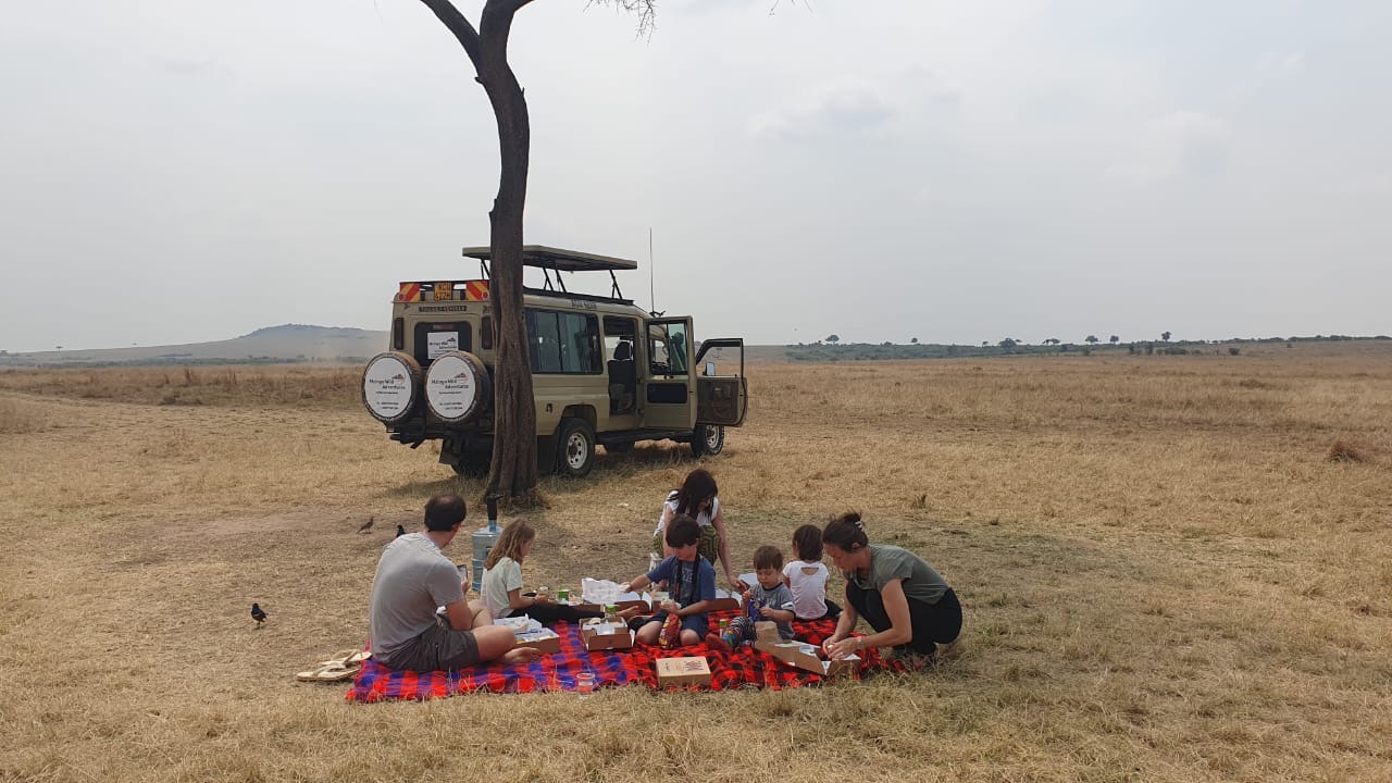 A family bush picnic on the Masai Mara plains