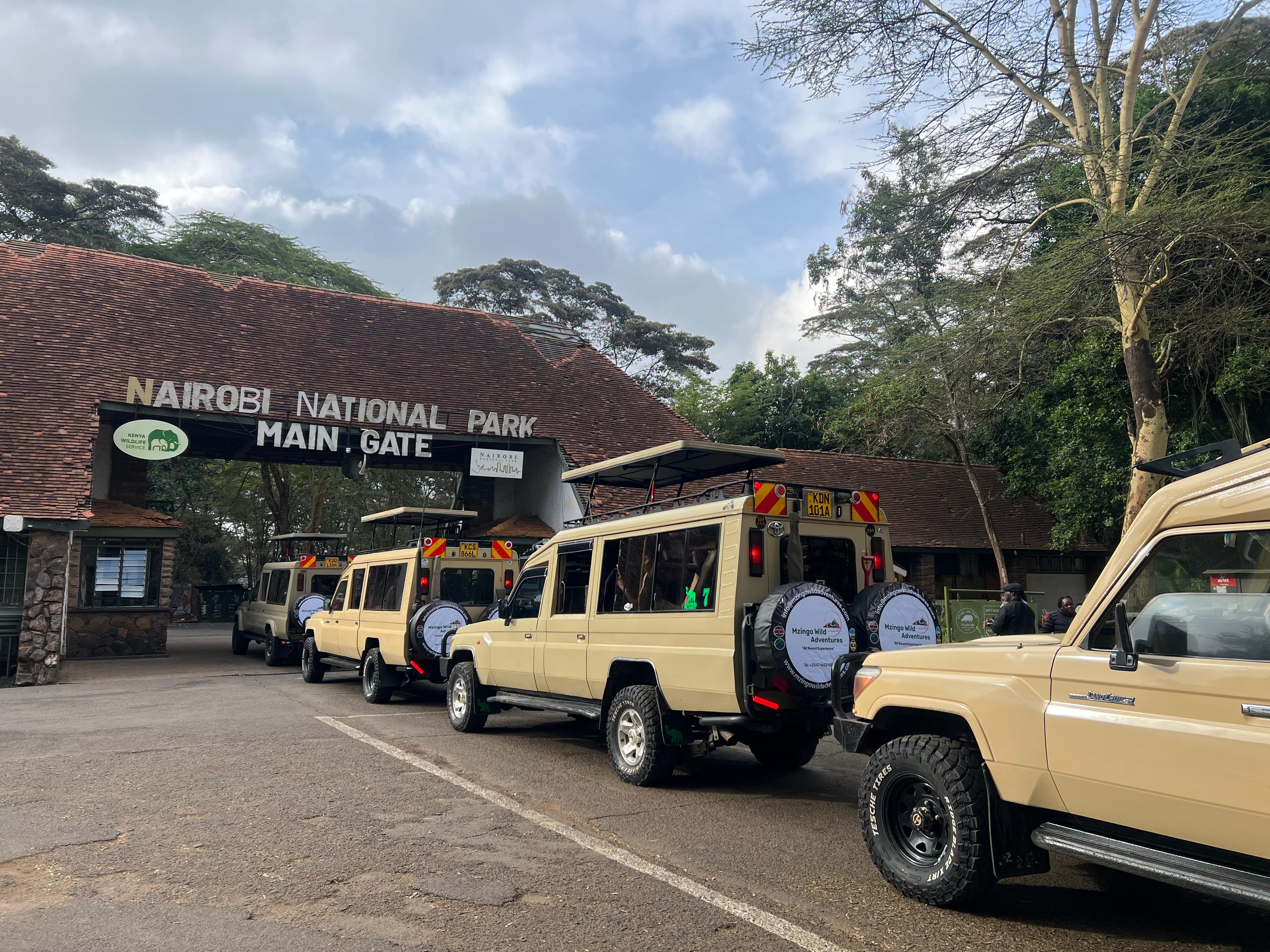Mzingo safari vehicles lined up at the Nairobi National Park main gate